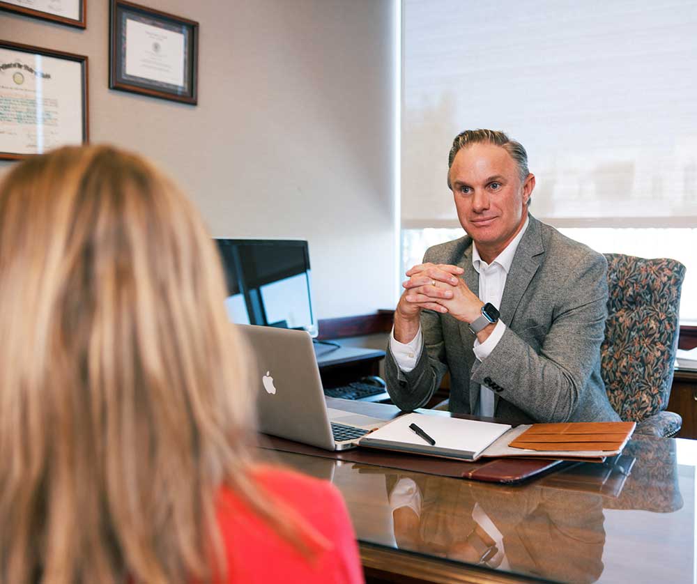 Image of attorney Patrick E. Mahoney from meeting with a client
